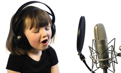 Little Girl Recording with microphone and pop filter