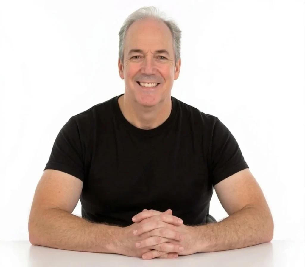 Ken Theriot sitting at desk