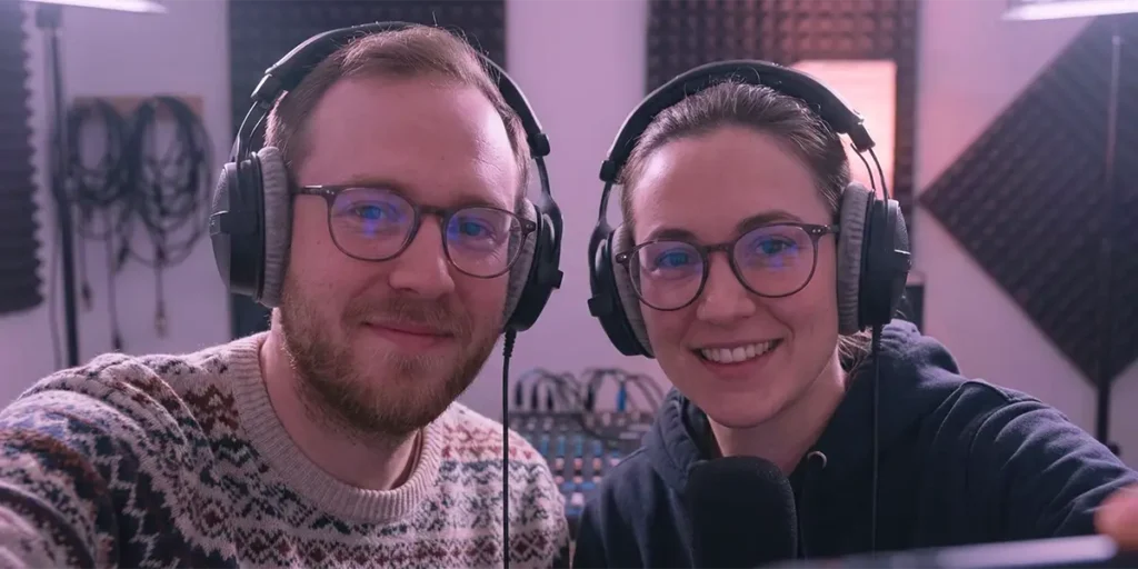 Two people wearing headphones