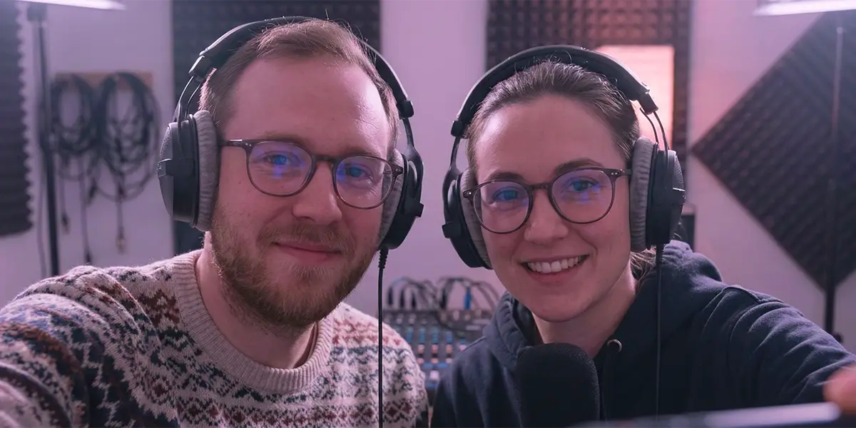 Two people wearing headphones